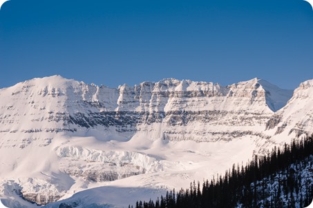 Lake-Louise-wedding-photographer_Fairmont-engagement-portraits_skating-ice-sculpture-festival___by-Kevin-Trowbridge-6