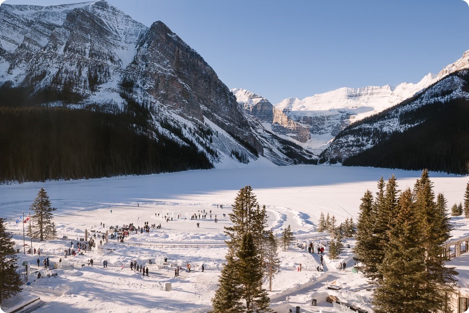 Lake-Louise-wedding-photographer_Fairmont-engagement-portraits_skating-ice-sculpture-festival___by-Kevin-Trowbridge