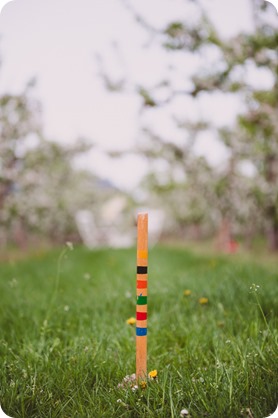 Kelowna-engagement-session_orchard-blossom_croquet-portraits_vintage-floral-dress_47_by-Kevin-Trowbridge